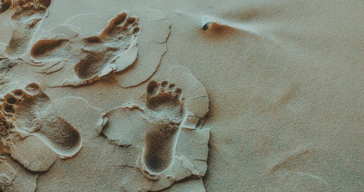 Footprints in the wet sand